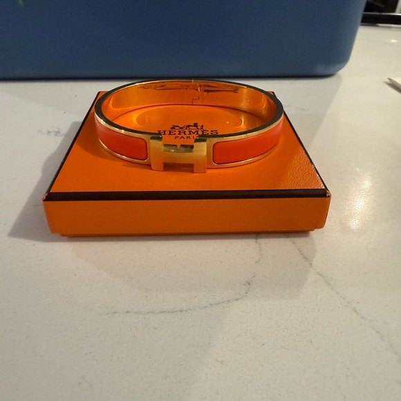 Hermes Jewelry - Hermès Orange and Gold Bracelet click clack bracelet.